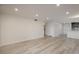 Open living room with wood flooring and recessed lighting, offering ample space at 800 N Pearl St # 611, Denver, CO 80203