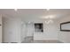Living room with wood flooring, with partial view into the kitchen at 800 N Pearl St # 611, Denver, CO 80203