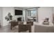 Bright living room with a fireplace, large windows offering views, and modern furnishings at 800 N Pearl St # 611, Denver, CO 80203