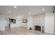 Living room showcasing a fireplace and a view into the modern kitchen at 800 N Pearl St # 611, Denver, CO 80203