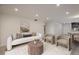 Cozy living room featuring a stylish sofa, chairs, and a view of the kitchen area at 800 N Pearl St # 611, Denver, CO 80203