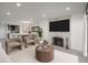 Cozy living room with fireplace, neutral tones, and views into the adjacent kitchen at 800 N Pearl St # 611, Denver, CO 80203
