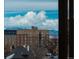 Scenic view of brick apartment buildings with snow-capped mountains in the background at 800 N Pearl St # 611, Denver, CO 80203