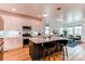 Modern kitchen features a center island, stainless steel appliances, and white cabinets at 3353 Wabash St, Denver, CO 80238