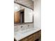 Bathroom with a modern double vanity and geometric tile at 9356 Cherrywood Trl, Littleton, CO 80127