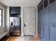 Spacious butler's pantry with stainless steel refrigerator and custom cabinetry at 9356 Cherrywood Trl, Littleton, CO 80127