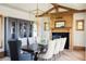 Elegant dining room features a large table and statement lighting at 9356 Cherrywood Trl, Littleton, CO 80127