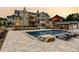 Luxury home exterior with pool and mountain views at 9356 Cherrywood Trl, Littleton, CO 80127