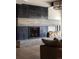 Modern fireplace with stone and metal detailing at 9356 Cherrywood Trl, Littleton, CO 80127