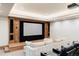 Basement home theater with large screen and comfortable seating at 9356 Cherrywood Trl, Littleton, CO 80127
