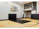 Indoor basketball court with hardwood floors and black accents at 9356 Cherrywood Trl, Littleton, CO 80127