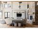 Living area with built-in entertainment center and stone fireplace at 9356 Cherrywood Trl, Littleton, CO 80127