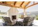 Outdoor living space with wood burning fireplace and stunning mountain views at 9356 Cherrywood Trl, Littleton, CO 80127