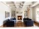 Cozy sitting area with fireplace and built-in shelving at 9356 Cherrywood Trl, Littleton, CO 80127