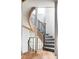 Modern spiral staircase with wood and metal accents at 9356 Cherrywood Trl, Littleton, CO 80127