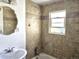 Bathroom with tiled shower/tub and window at 3798 S Grant St, Englewood, CO 80113