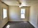 Well-lit bedroom featuring neutral walls, carpet, and a ceiling fan at 3798 S Grant St, Englewood, CO 80113