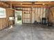 A spacious garage with a concrete floor, exposed framing and convenient access to the backyard at 3798 S Grant St, Englewood, CO 80113