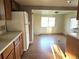 Kitchen with modern appliances and sleek laminate flooring at 3798 S Grant St, Englewood, CO 80113