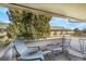 Relaxing balcony with outdoor seating and views of lush greenery and complex at 9925 W 20Th Ave # 17, Lakewood, CO 80215