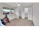 Bedroom featuring stationary bike, and access to dual walk-in closets at 9925 W 20Th Ave # 17, Lakewood, CO 80215