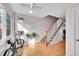 Inviting entryway with hardwood floors, a staircase, ample natural light, and indoor plants at 9925 W 20Th Ave # 17, Lakewood, CO 80215