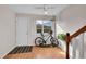Bright entryway with hardwood floors, neutral walls, natural light, and convenient bike storage at 9925 W 20Th Ave # 17, Lakewood, CO 80215