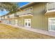 Green two story exterior of townhome building with patios and lush lawn at 9925 W 20Th Ave # 17, Lakewood, CO 80215