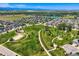 Aerial view of the neighborhood with large green park and walking trails at 3508 E 140Th Pl, Thornton, CO 80602