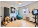 Bedroom featuring light wood flooring, comfortable beanbag chair, and fun decor at 3508 E 140Th Pl, Thornton, CO 80602
