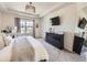 Bright Primary bedroom with tray ceiling, plush carpeting, and modern decor at 3508 E 140Th Pl, Thornton, CO 80602