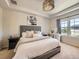 Cozy bedroom featuring a plush bed, stylish furnishings, and a serene atmosphere at 3508 E 140Th Pl, Thornton, CO 80602