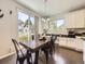Dining area with sliding glass doors to the backyard and lots of natural light at 3508 E 140Th Pl, Thornton, CO 80602