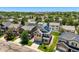 Aerial view of craftsman style houses with mature trees in the neighborhood at 3508 E 140Th Pl, Thornton, CO 80602
