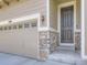 Close up of the front entrance with stone accents and garage at 3508 E 140Th Pl, Thornton, CO 80602
