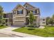 Charming two-story home with a well-manicured lawn, attached two car garage, and inviting front porch at 3508 E 140Th Pl, Thornton, CO 80602