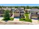 Two-story home featuring a manicured lawn, two car garage, and inviting front porch at 3508 E 140Th Pl, Thornton, CO 80602