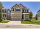 Charming two-story home with a well-manicured lawn, attached two car garage, and inviting front porch at 3508 E 140Th Pl, Thornton, CO 80602