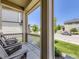 Inviting front porch with rocking chairs, offering a relaxing outdoor seating area at 3508 E 140Th Pl, Thornton, CO 80602