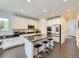 Gourmet kitchen with stainless appliances, granite counters, and large island with breakfast bar at 3508 E 140Th Pl, Thornton, CO 80602