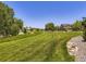 Serene view of the neighborhood park with green space and walking paths at 3508 E 140Th Pl, Thornton, CO 80602