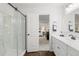 Beautifully remodeled bathroom features a walk-in shower, and a dual sink vanity at 1285 Aberdeen Dr, Broomfield, CO 80020