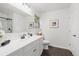 Well-lit bathroom with an elegant vanity, modern fixtures, and a walk-in shower at 1285 Aberdeen Dr, Broomfield, CO 80020