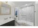 Bright bathroom with modern vanity, updated shower, and neutral tile at 1285 Aberdeen Dr, Broomfield, CO 80020