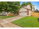 Charming two-story home with a well-manicured lawn, a spacious driveway, and an attached two-car garage at 1285 Aberdeen Dr, Broomfield, CO 80020