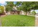 Charming home with lush green lawn, mature trees, and a well-maintained exterior at 1285 Aberdeen Dr, Broomfield, CO 80020