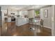 Bright kitchen with white cabinets, stainless steel appliances, and a breakfast nook, perfect for morning meals at 1285 Aberdeen Dr, Broomfield, CO 80020