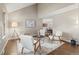 Stylish living room featuring vaulted ceilings, modern furniture, hardwood floors, and neutral paint at 1285 Aberdeen Dr, Broomfield, CO 80020