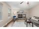 Inviting living room with fireplace, plush seating, ceiling fan, and an abundance of natural light at 1285 Aberdeen Dr, Broomfield, CO 80020