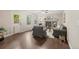 Open floor plan boasts a fireplace, hardwood floors, and a comfortable seating arrangement at 1285 Aberdeen Dr, Broomfield, CO 80020